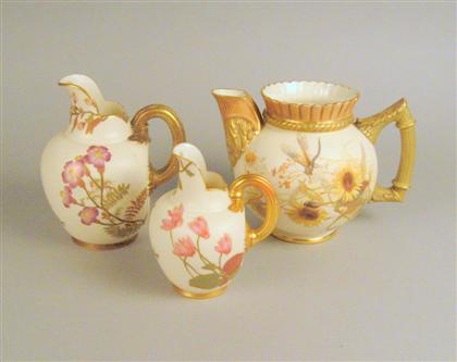 Appraisal: Group of three Royal Worcester porcelain gilt decorated jugs Each