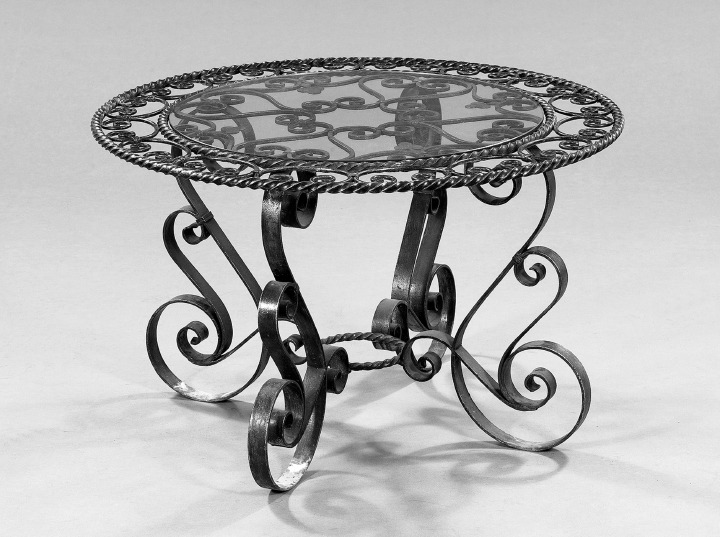 Appraisal: Continental Wrought-Iron and Glass Cocktail Table the circular top rendered