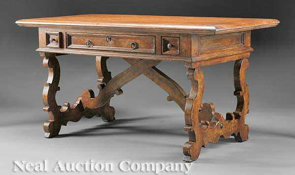 Appraisal: An Italian Carved Walnut Trestle Table of Renaissance Inspiration rectangular