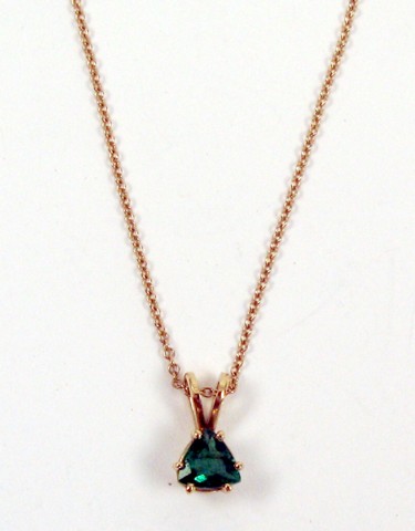 Appraisal: EMERALD AND YELLOW GOLD PENDANT NECKLACE The pendant is suspended