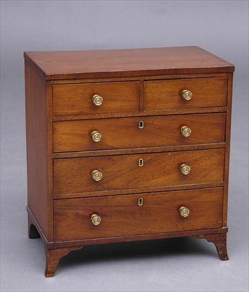 Appraisal: GEORGE III MAHOGANY MINIATURE CHEST OF DRAWERS The rectangular top