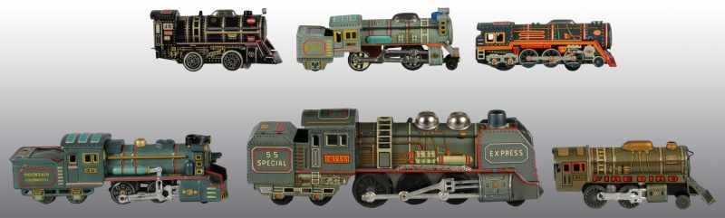 Appraisal: Lot of Tin Train Engines Description Japanese Includes friction battery-operated