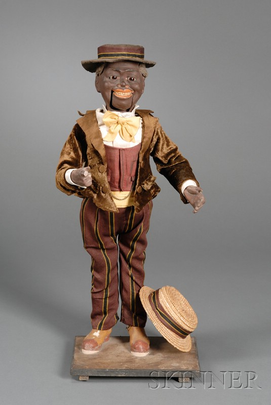 Appraisal: Clockwork Black Gentleman Nodder Automaton dressed in original velvet waistcoat