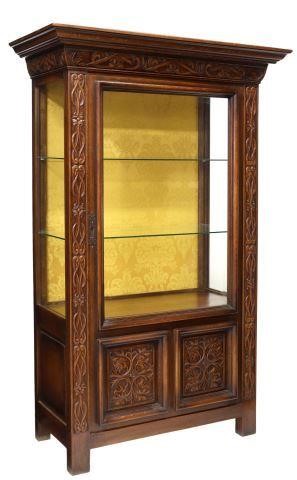 Appraisal: French Renaissance Revival carved oak vitrine display cabinet early th