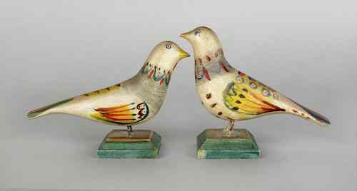 Appraisal: Pair of carved and vibrantly painted song birds on green