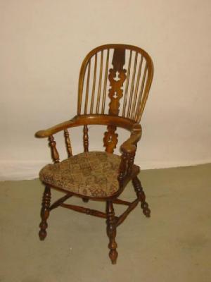 Appraisal: AN ASH AND ELM WINDSOR ARMCHAIR of high hoop back