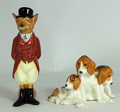 Appraisal: Royal Worcester model of three foxhound puppys and Royal Doulton