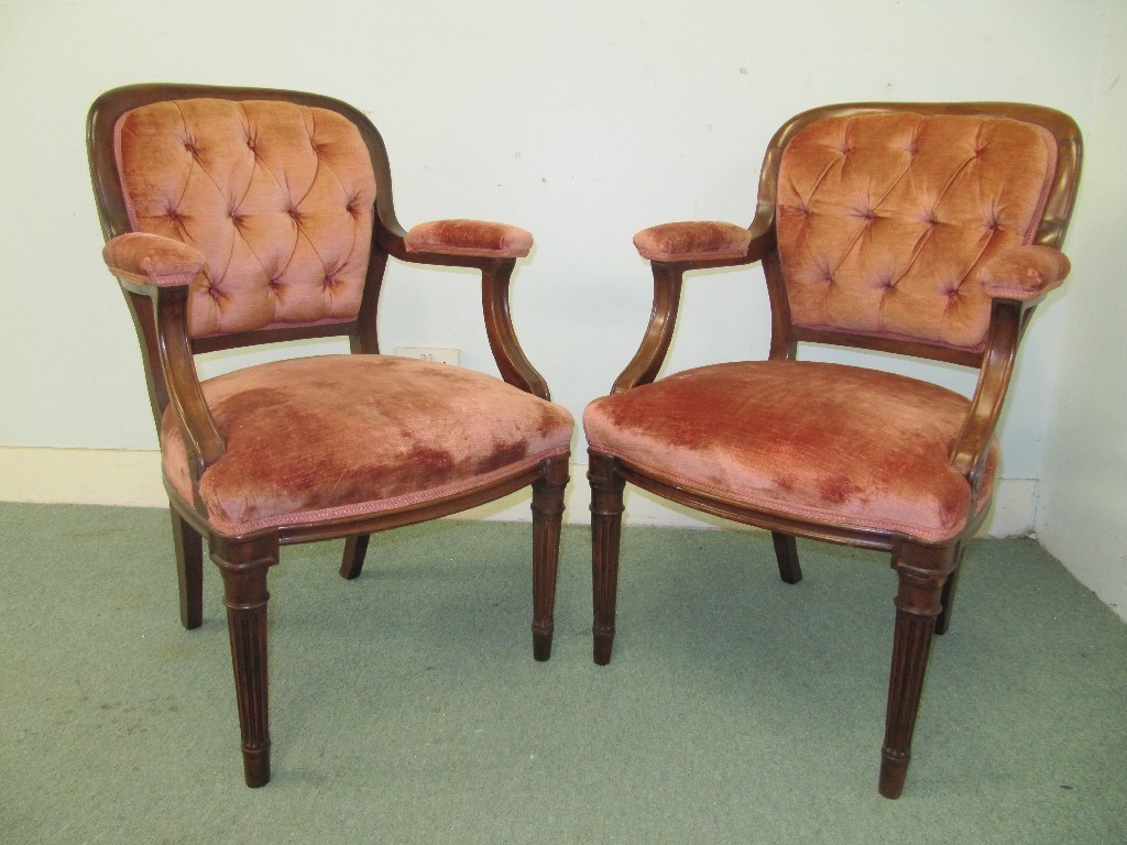 Appraisal: A pair of late Victorian mahogany buttonback elbow chairs upholstered