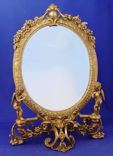 Appraisal: ORNATE BRASS CHERUBIC PETTICOAT MIRROR Decorative and detailed first quarter