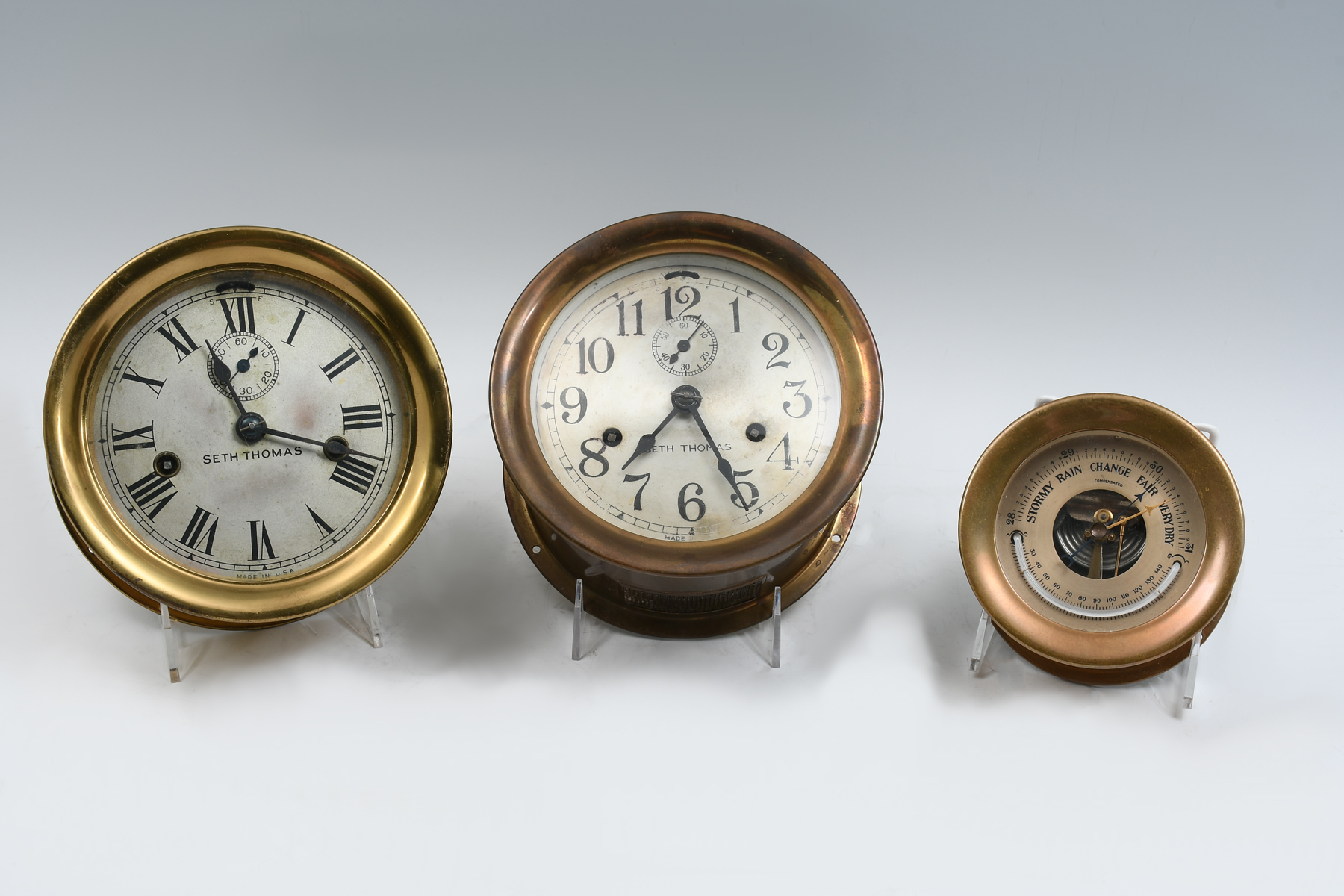 Appraisal: SETH THOMAS SHIPS CLOCKS BAROMETER Comprising - Seth Thomas brass