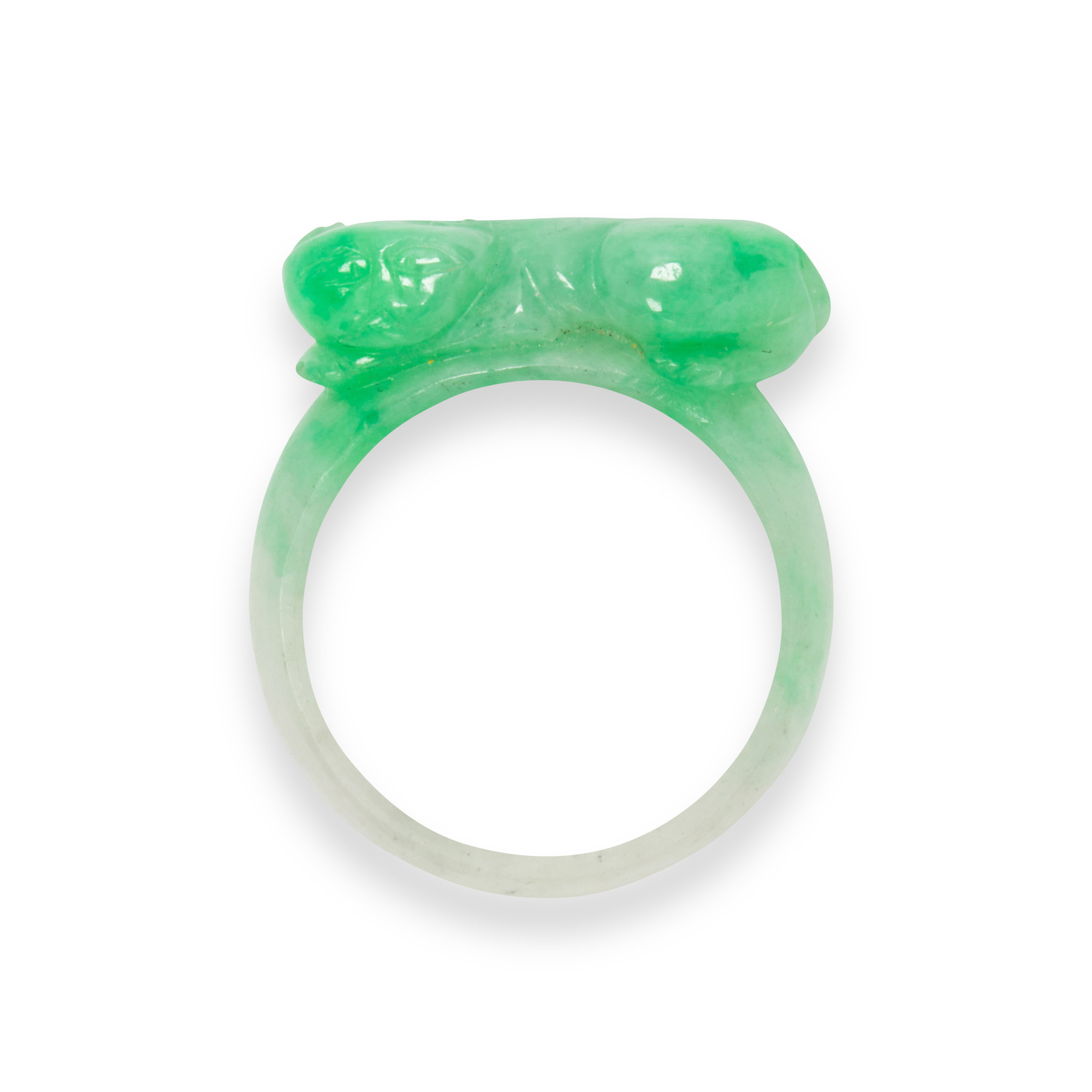 Appraisal: A JADEITE RING A jadeite ring designed as a carved