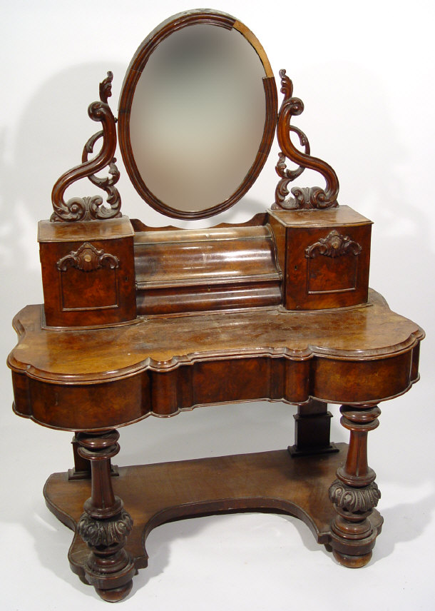 Appraisal: Victorian walnut mirror backed duchess dressing table the oval mirror