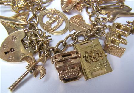 Appraisal: A 's ct gold charm bracelet composed of curb links