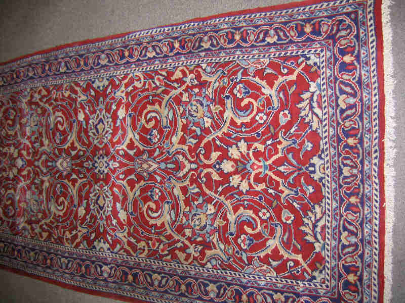 Appraisal: SAROUK RUNNER The rich red field shows an allover curvilinear