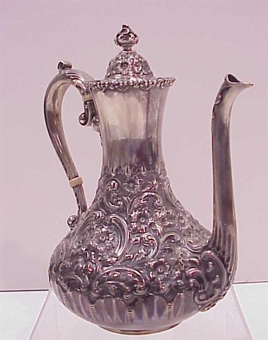 Appraisal: Sterling Dominick Haff individual coffee pot repousse floral decoration pear