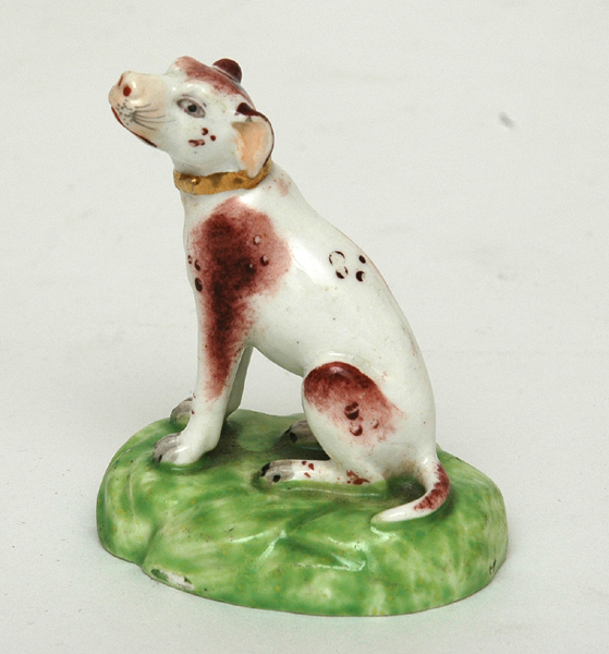 Appraisal: A TH CENTURY STAFFORDSHIRE FIGURE OF A DOG Modelled as