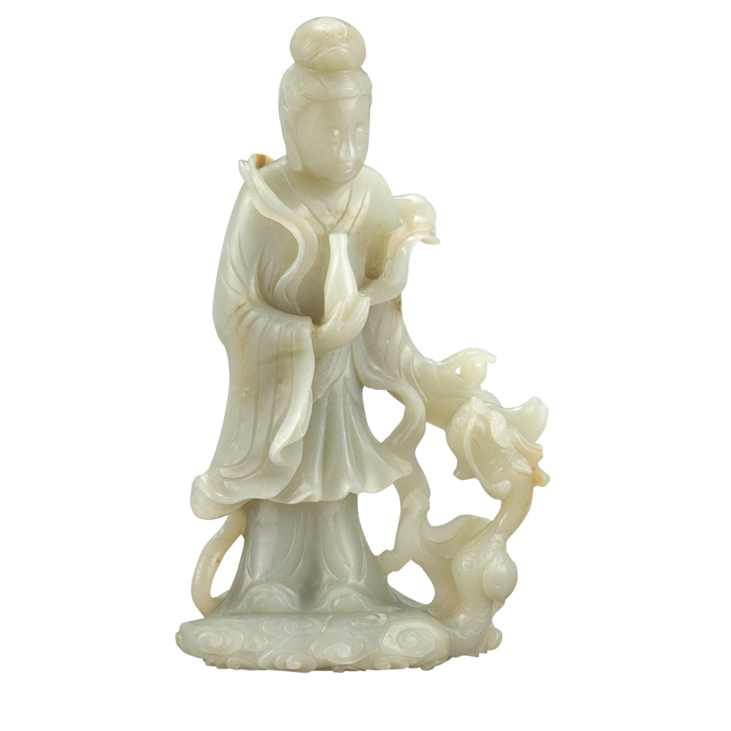 Appraisal: Chinese Celadon Jade Guanyin Qing dynasty The figure standing gazing