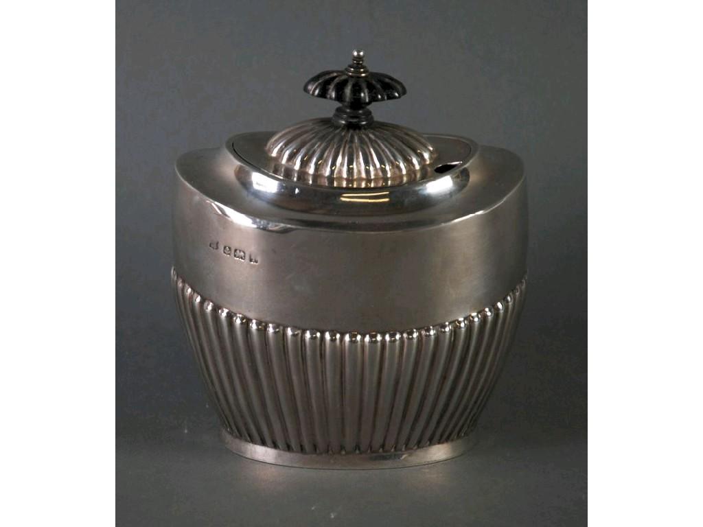 Appraisal: GEORGE V SILVER TEA CADDY oval part fluted form with