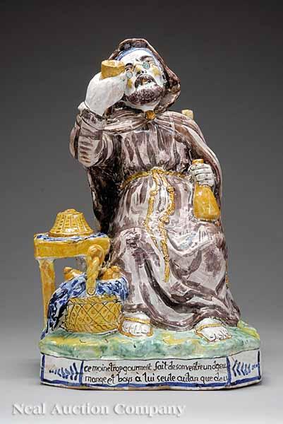 Appraisal: A French Faience Figure of a Drinking Monk th c