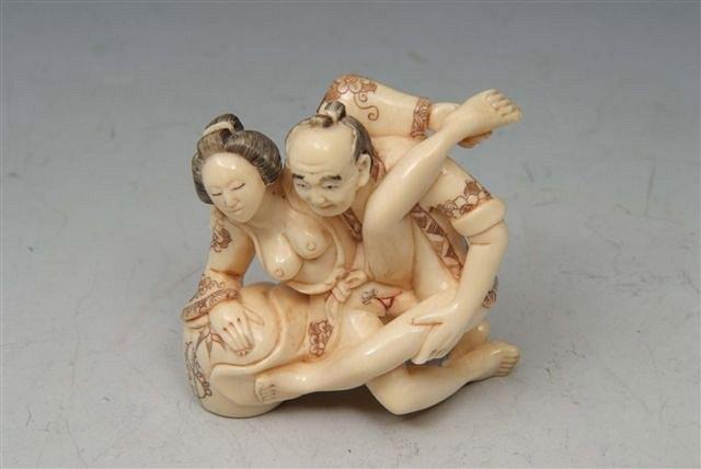 Appraisal: A JAPANESE IVORY NETSUKE carved in the form of a