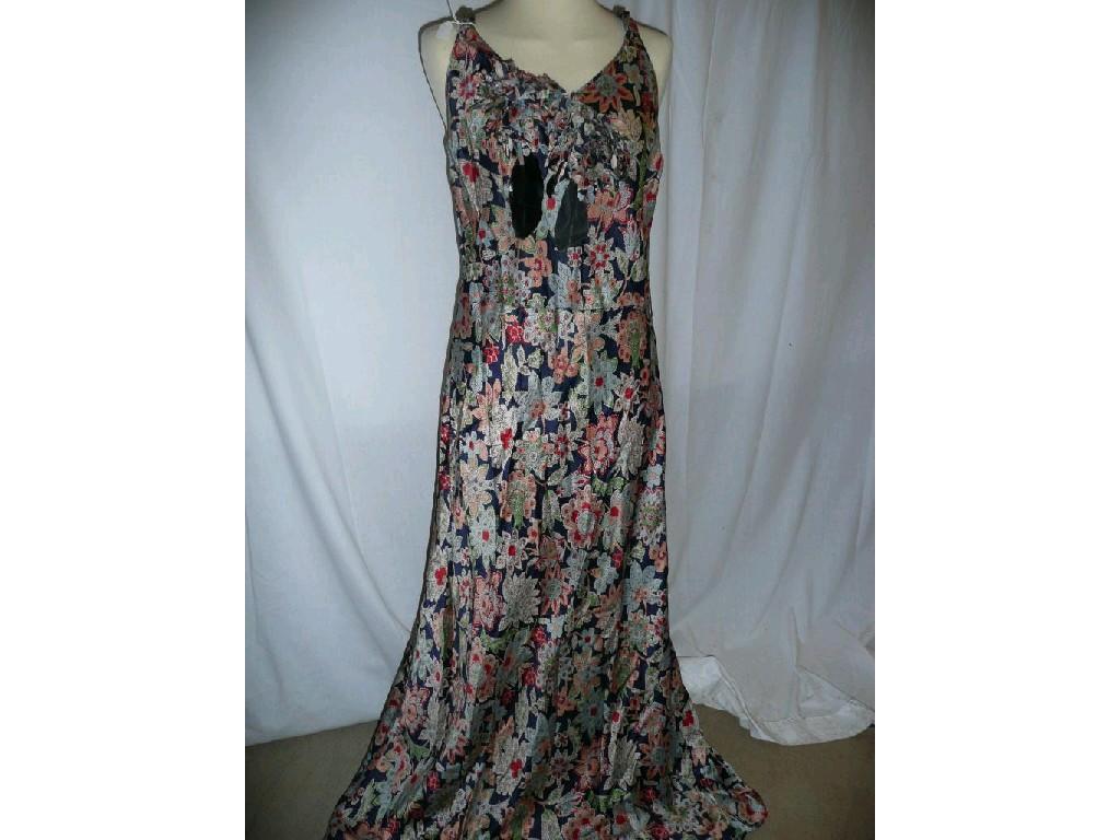 Appraisal: A vintage satin evening dress with multi flower design shoulder