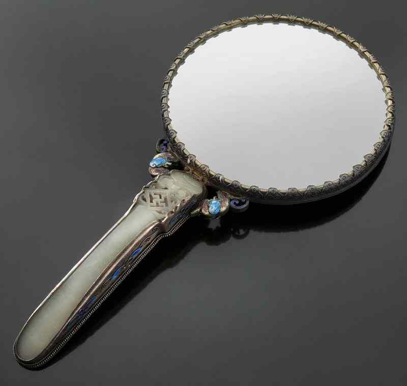 Appraisal: Chinese jade mounted enamel over silver mirror the carved jade