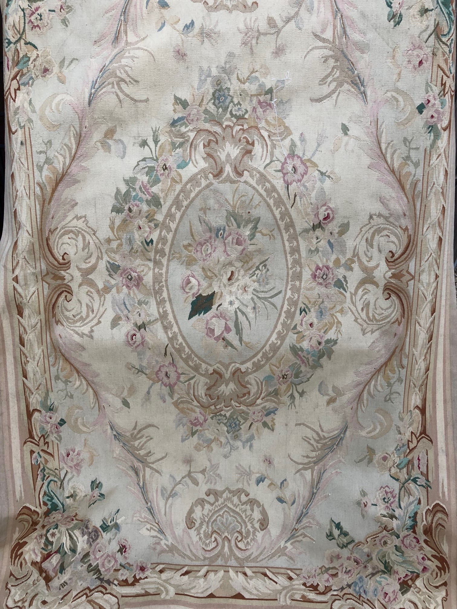 Appraisal: A needlework carpet of cream ground in the Aubusson style