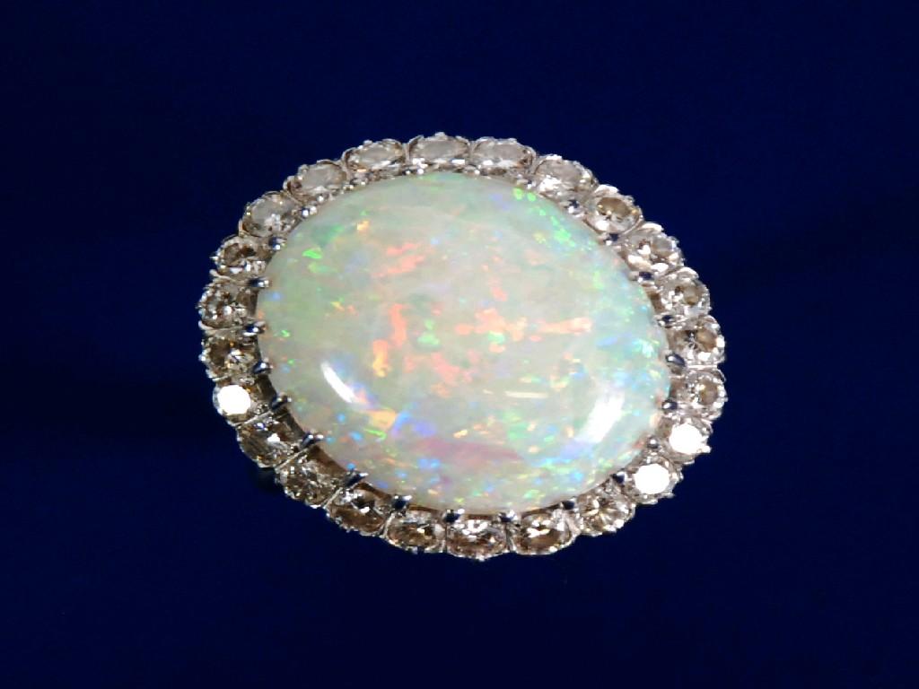 Appraisal: ct GOLD OPAL AND DIAMOND OVAL CLUSTER RING set with