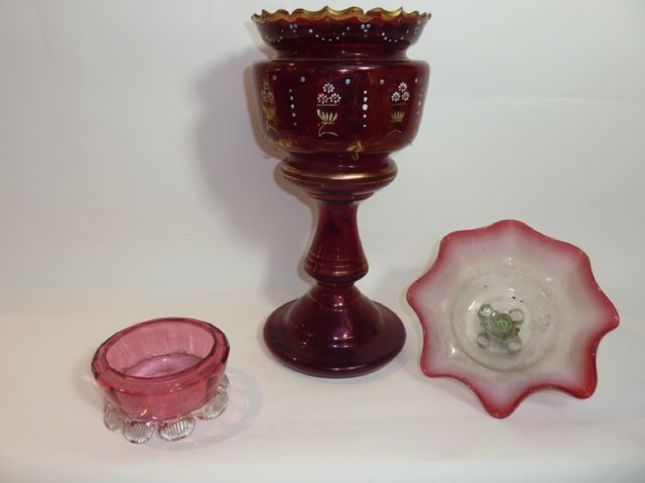 Appraisal: A tall th century cranberry glass jardini re on a