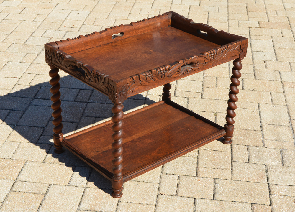 Appraisal: BARLEY TWIST OAK TEA TABLE Top with carved foliate motif