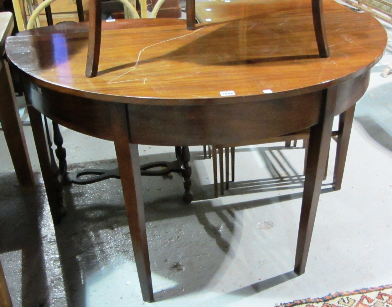 Appraisal: A George III mahogany semi circular side table on tapering