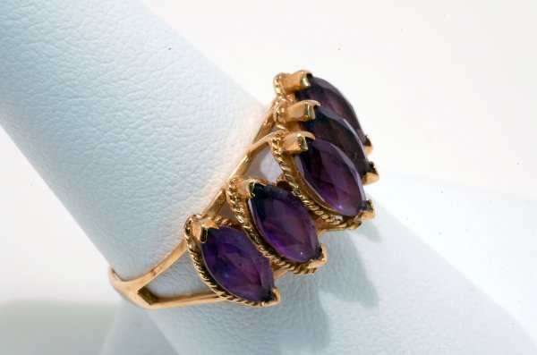 Appraisal: Amethyst ring yellow gold setting marked K having five amethysts