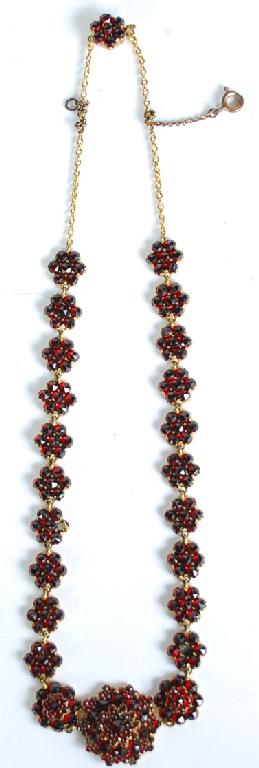 Appraisal: VICTORIAN NECKLACE WITH TWENTY THREE GARNET DAISY CLUSTER GRADUATED LINKS