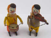 Appraisal: Two vintage German tinplate performing clowns one a drummer one