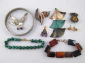 Appraisal: A mixed lot including white metal tests silver brooches and