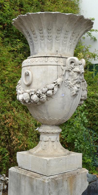 Appraisal: A COMPOSITE VERSAILLES URN ON PLINTH moulded with garland and