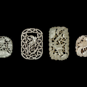 Appraisal: Four Chinese White and Celadon Jade Reticulated Pendants each of