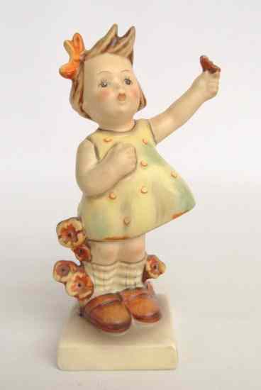 Appraisal: Hummel figurine girl with flower full Bee '' Ht