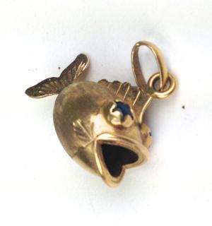 Appraisal: k yellow gold open mouth fish figural charm with blue