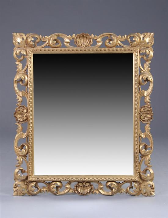 Appraisal: ITALIAN ROCOCO STYLE WALL MIRROR th century gilt-wood Foliate-and-shell carved