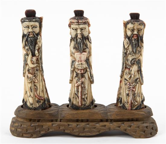 Appraisal: Sale Lot Three Carved Bone Figures depicting immortals and raised