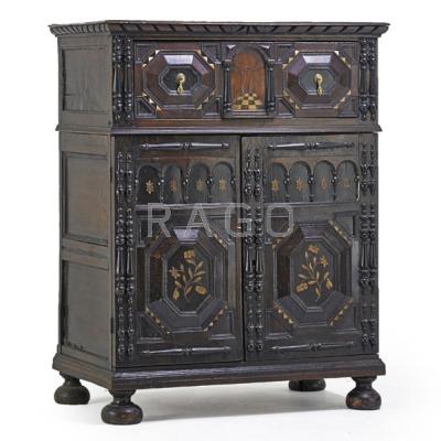 Appraisal: ELIZABETHAN CABINET ON CHEST Two-piece in oak with foliate inlay