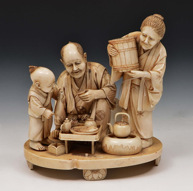 Appraisal: A Japanese ivory okimono of a family groupMeiji periodsigned showing