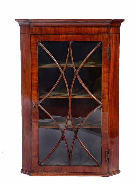 Appraisal: A GEORGE III MAHOGANY HANGING CORNER CABINET the interior fitted