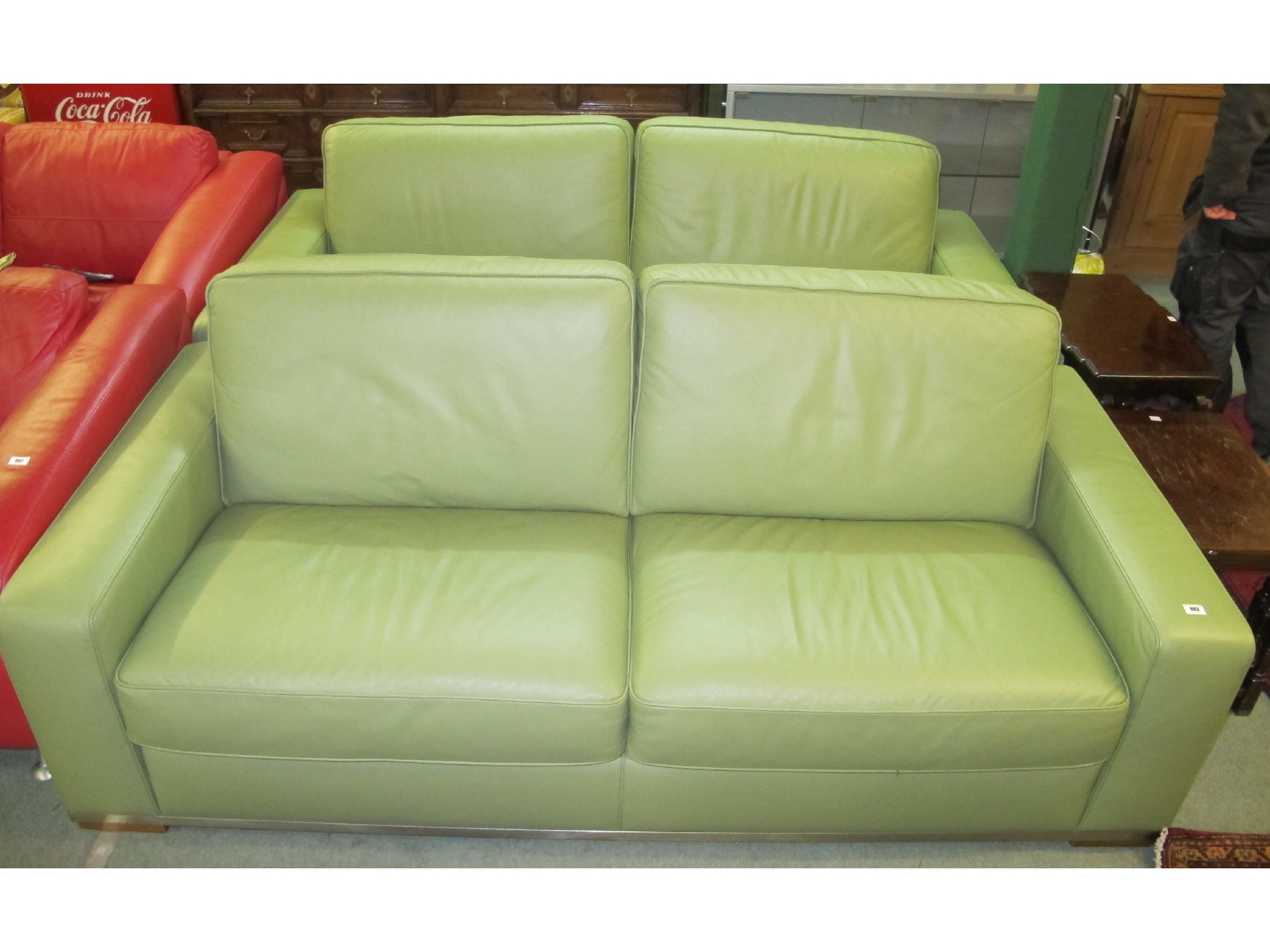 Appraisal: Pair of lime green leather three seater settees