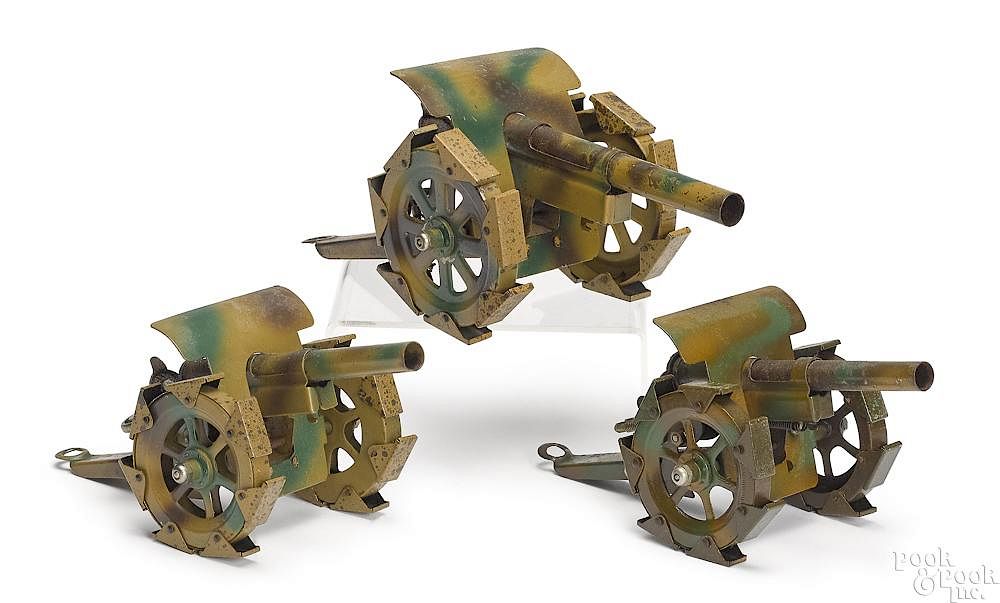 Appraisal: Three German camouflage painted tin field guns Three German camouflage