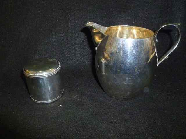 Appraisal: A SILVER JUG of plain baluster form with loop handle