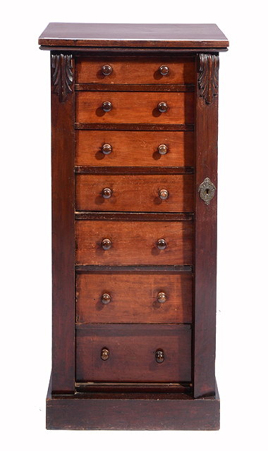 Appraisal: A VICTORIAN MAHOGANY WELLINGTON CHEST of seven long drawers with