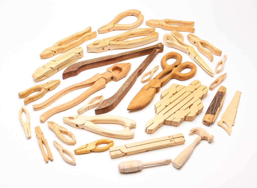 Appraisal: Twentieth century An assortment of tools carved from one piece