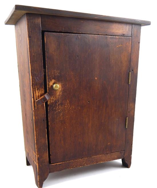 Appraisal: MINIATURE th C cabinet single door red stain bootjack legs